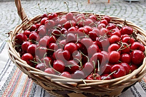 Cherries. Cherry. Organic cherries in basket on a farmerÃ¢â¬â¢s market. Red cherry background. Fresh cherries texture. Healthy food.